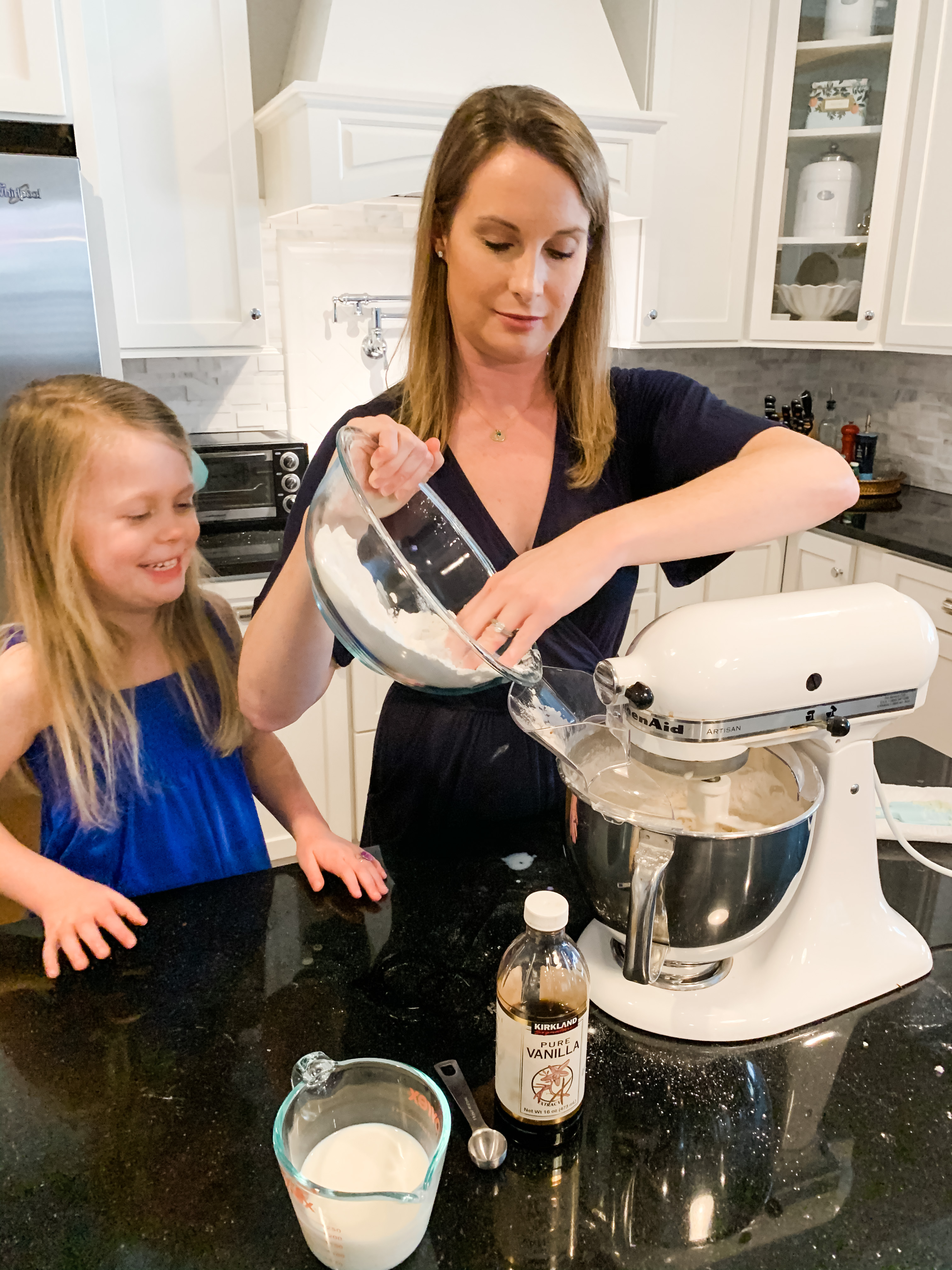 STEP 7 : Add your dry ingredients a little bit at a time. Repeat after me, go sloooooow. Or else you'll end up with a flour explosion on your hands.....and counter, and face, and hair...you get the picture.