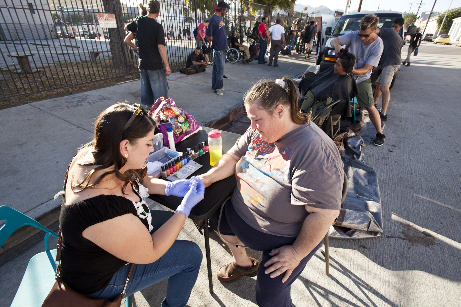 Volunteer Manicurist treating GWHFC clients