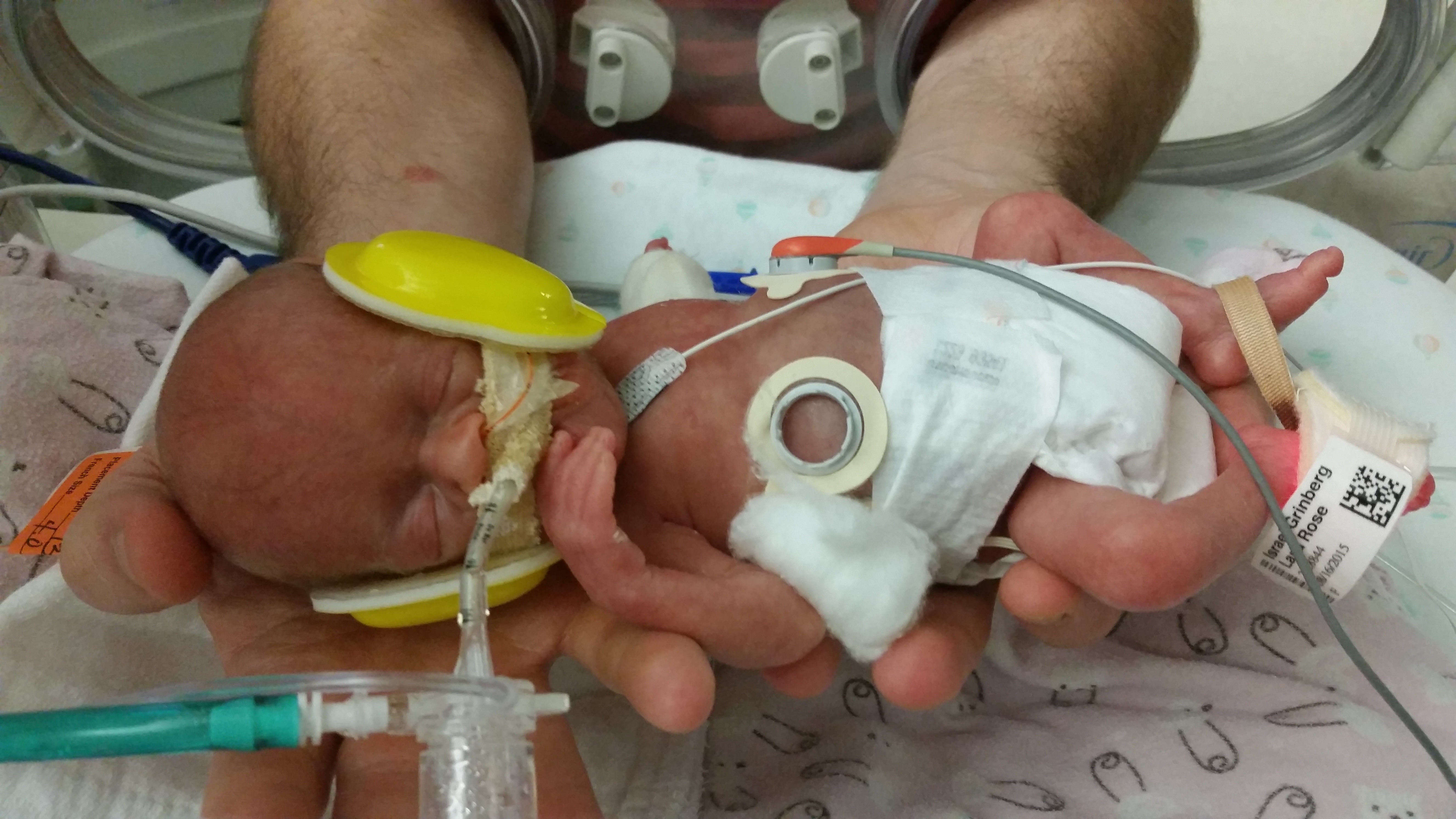 Daddy holding Lana for the first time