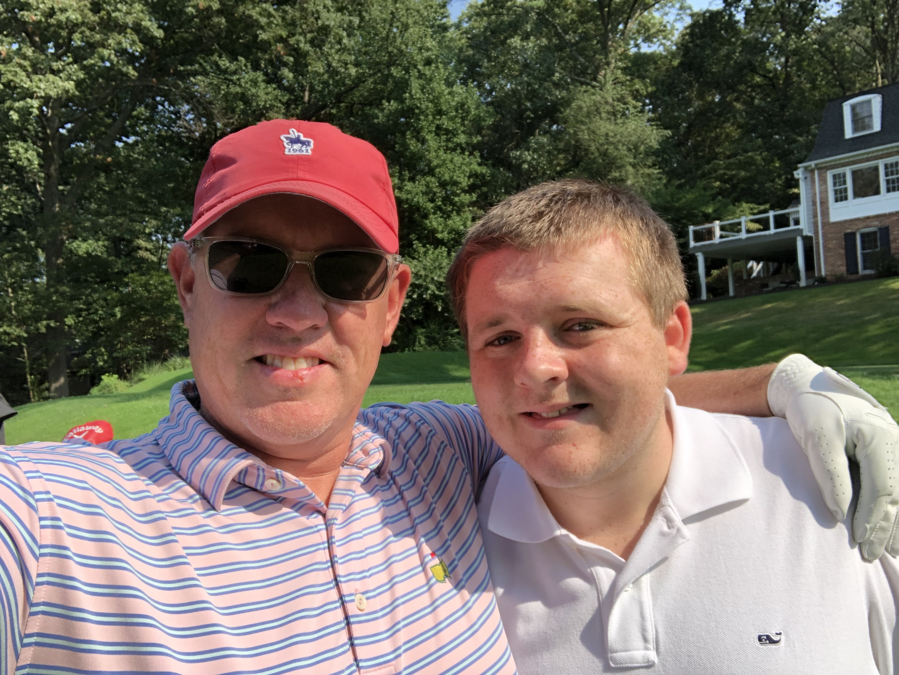 My son Carter and I playing golf.