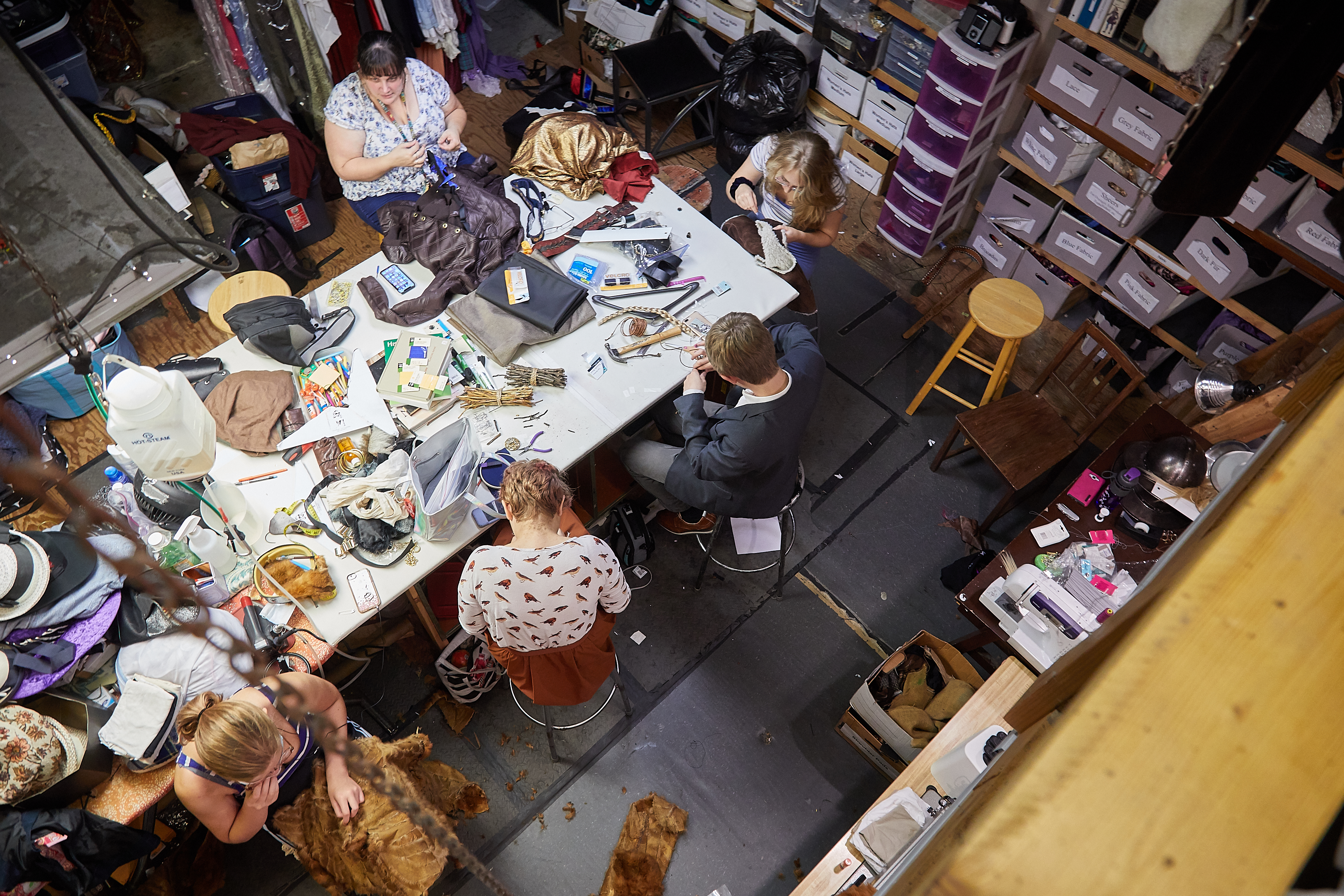 Costume Shop Manager, Jocelyne Fowler, helps students build costumes for Camp Bill, photo by Steve Korn