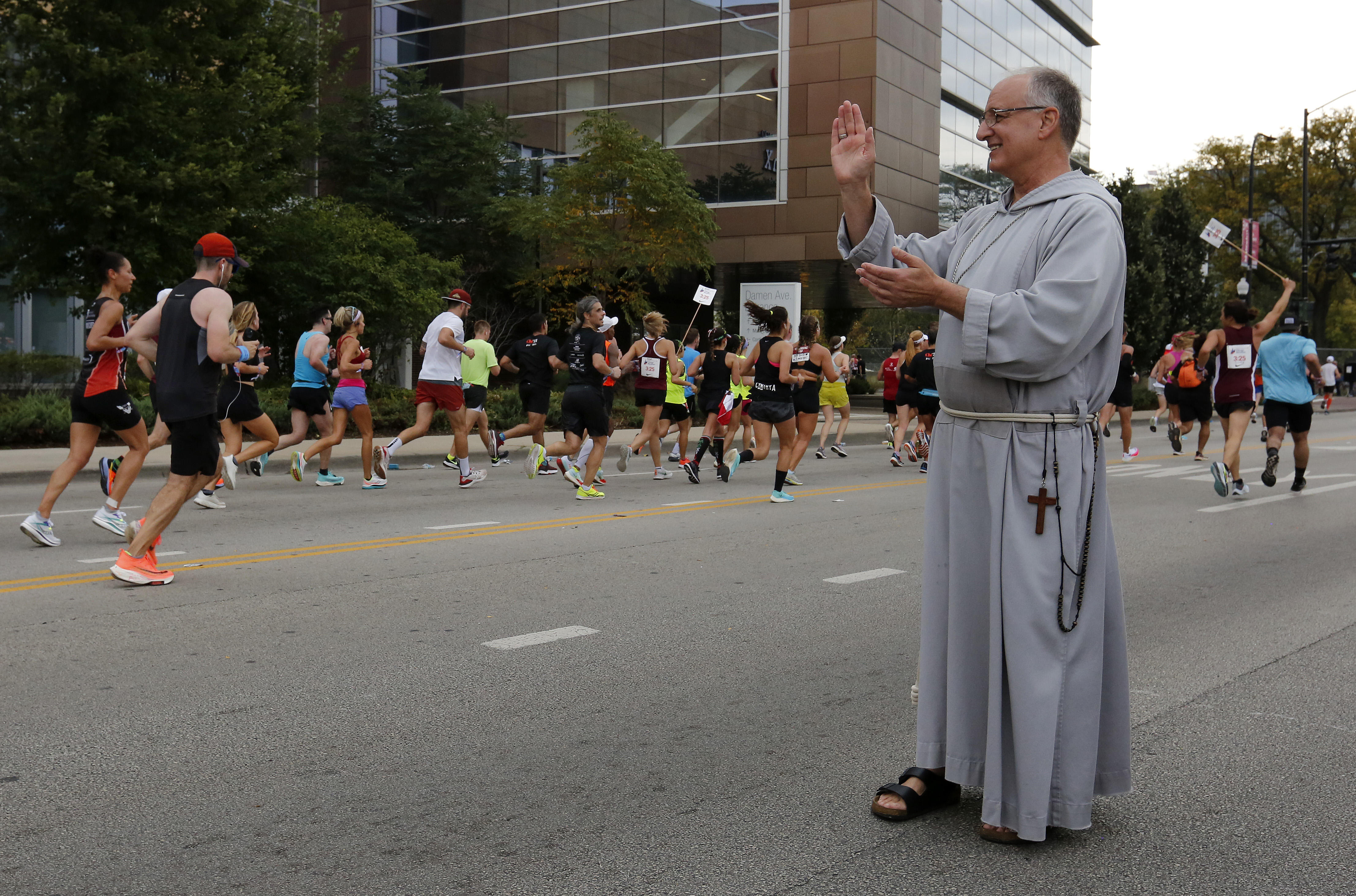 Bishop Bob blessing runners at the 2021 Chicago Marathon!