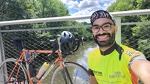 Brother Ramon Dejesus posted up with his orange Lemond over a Charles River inlet crossing