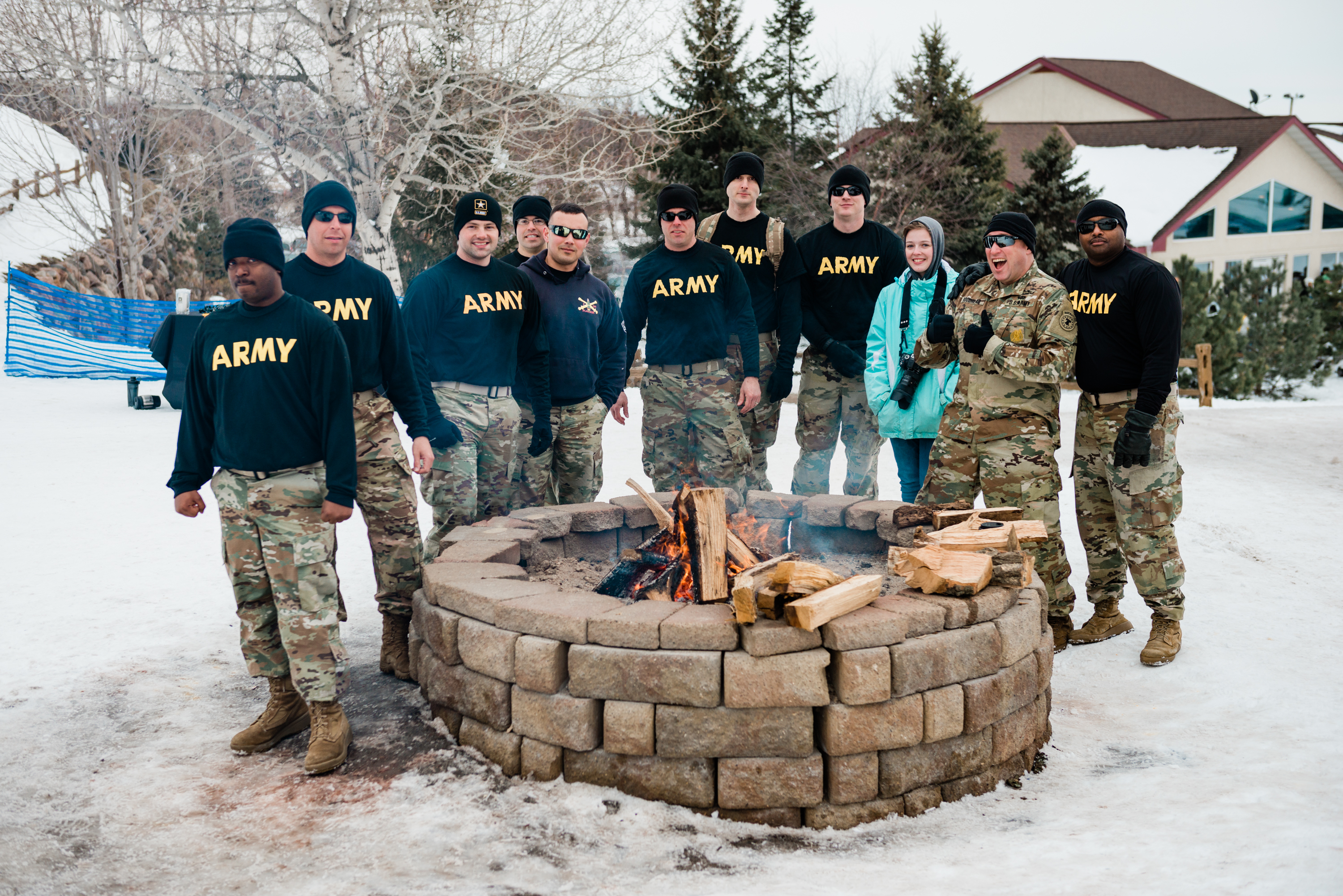US Army Teams warming up around the firepit!