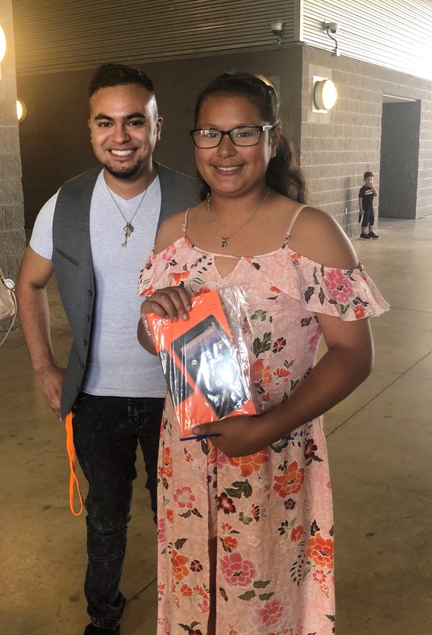 CIS staff attending CIS student's 5th grade graduation ceremony