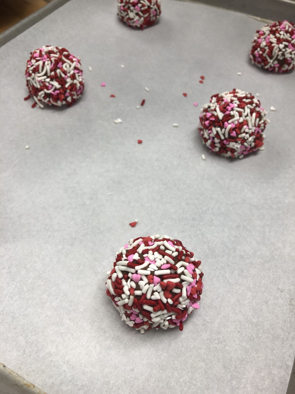 cookies placed apart on pan with parchment paper