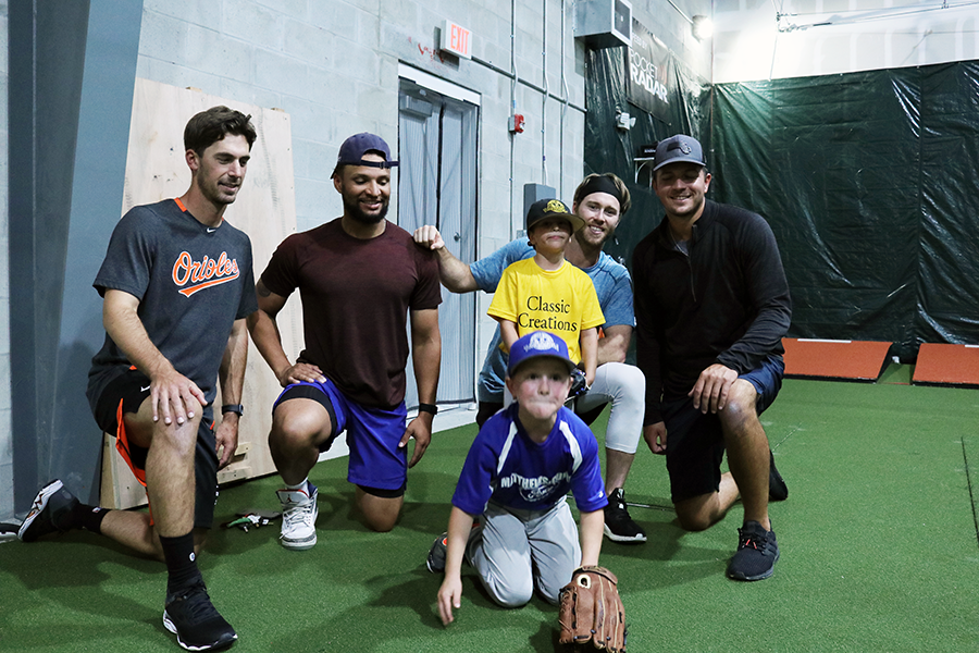 Dean living out his dream with professional baseball players