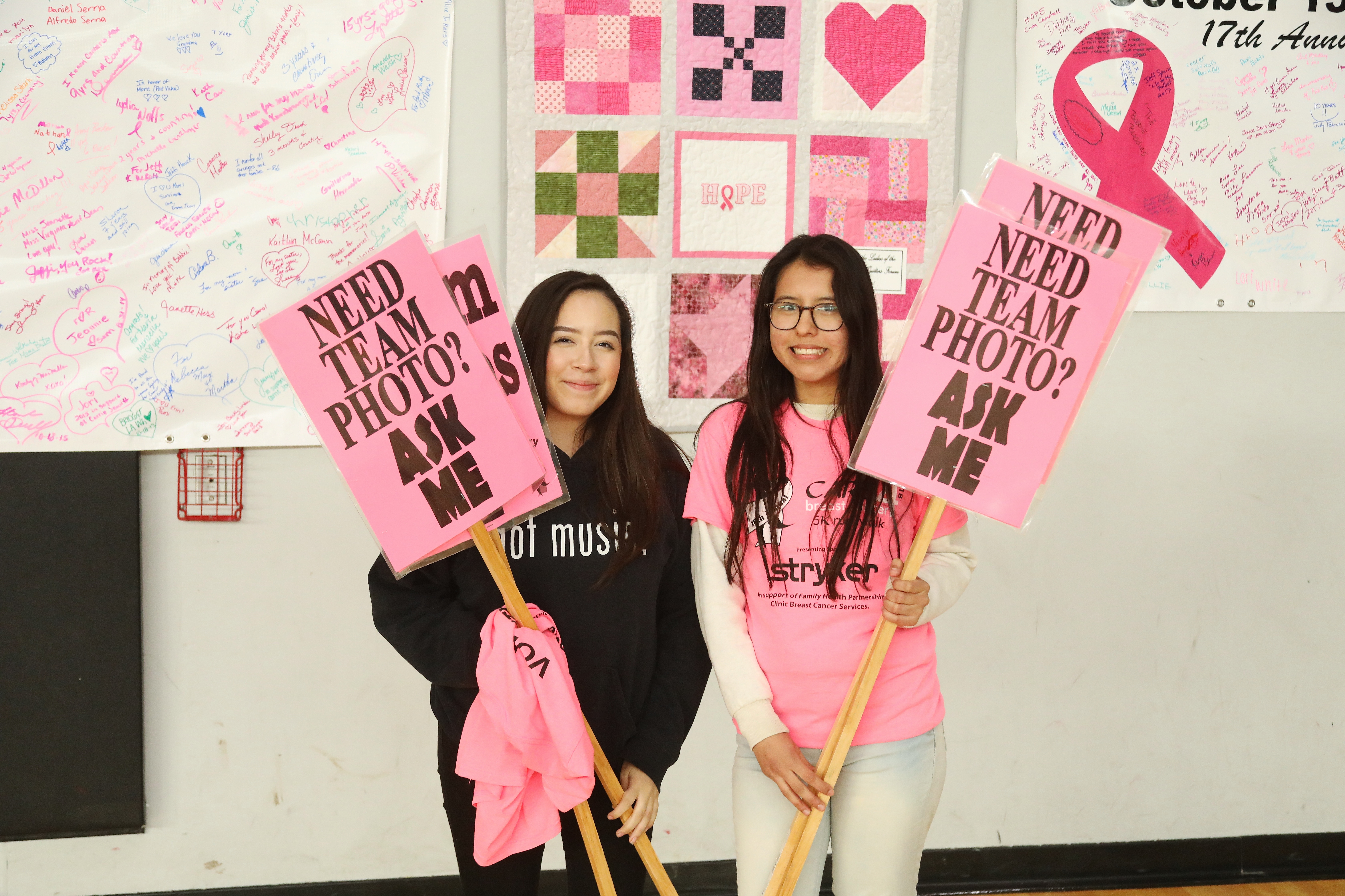 Two volunteers helping with Saturday set-up.