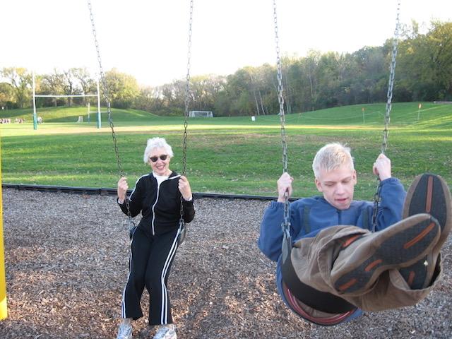 Johnny swinging with Grandma