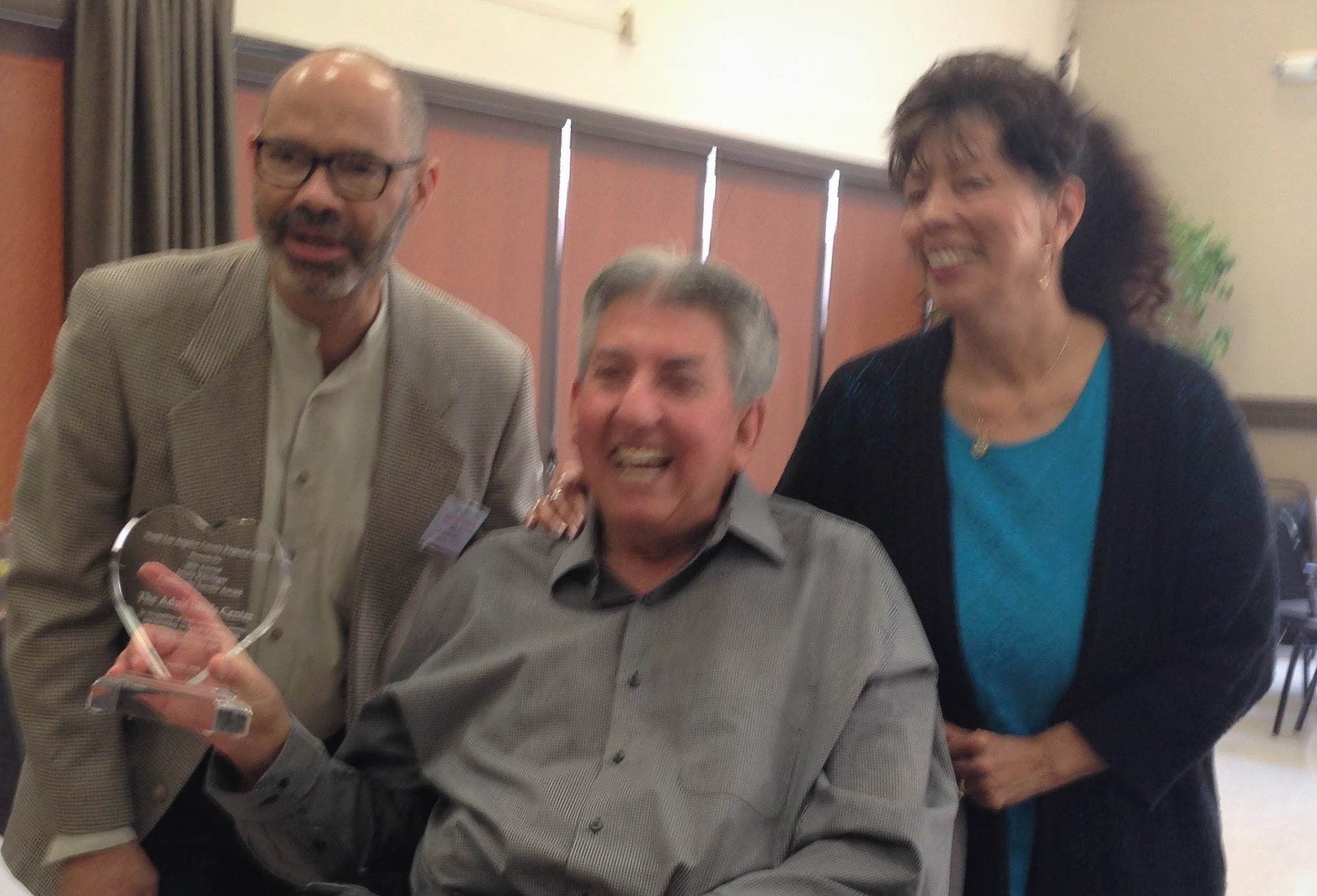 George Stevens giving Jenny Ratzinger award to Ken and TASC