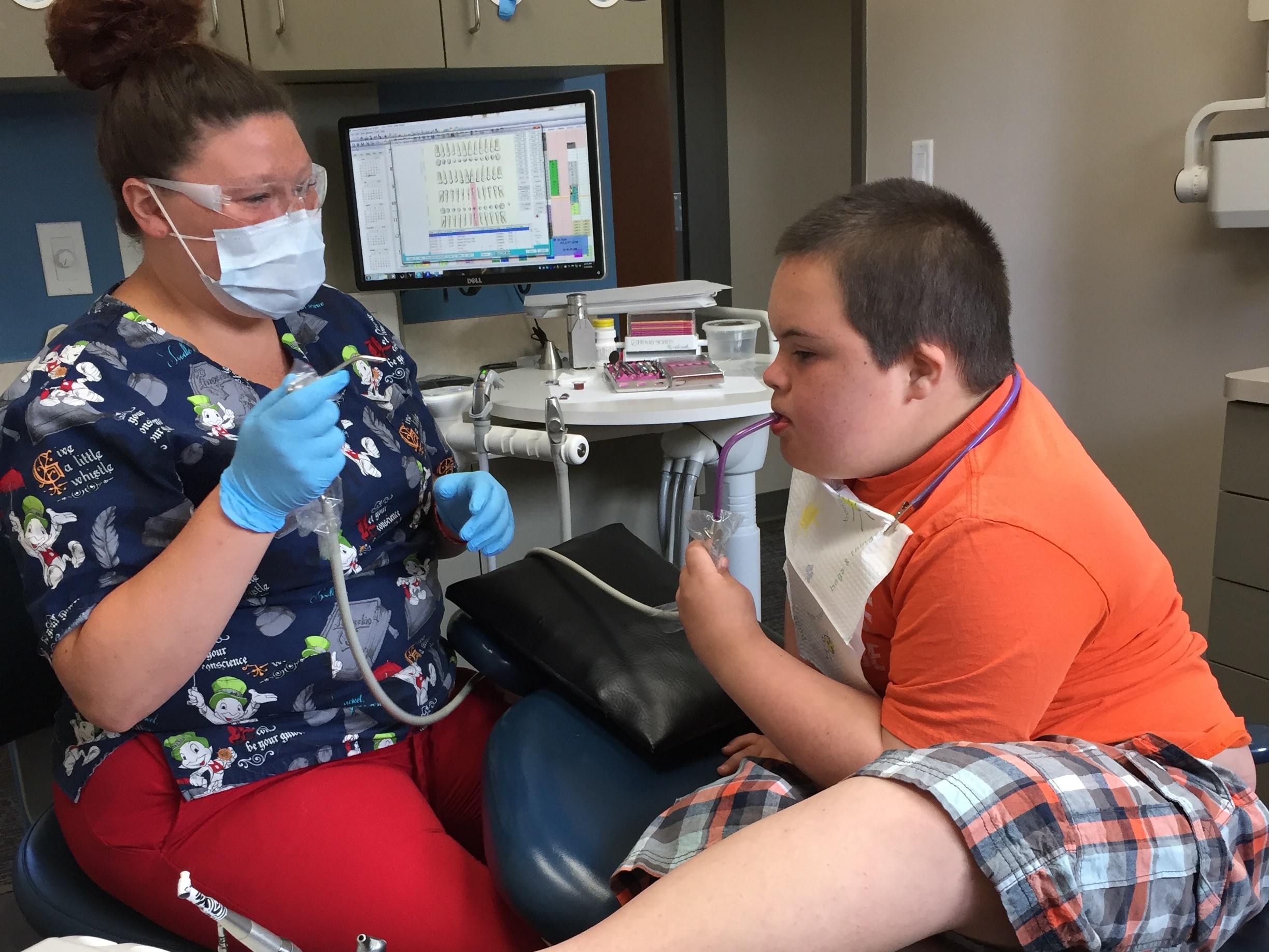 Quin getting his teeth cleaned by Dena