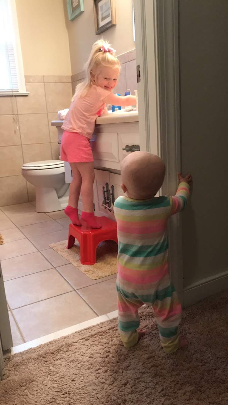 Learning to pull up and walk in between hospital visits and chemo. Holden loved watching Sissy!