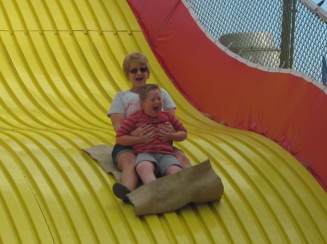 Going down the big slide with mom