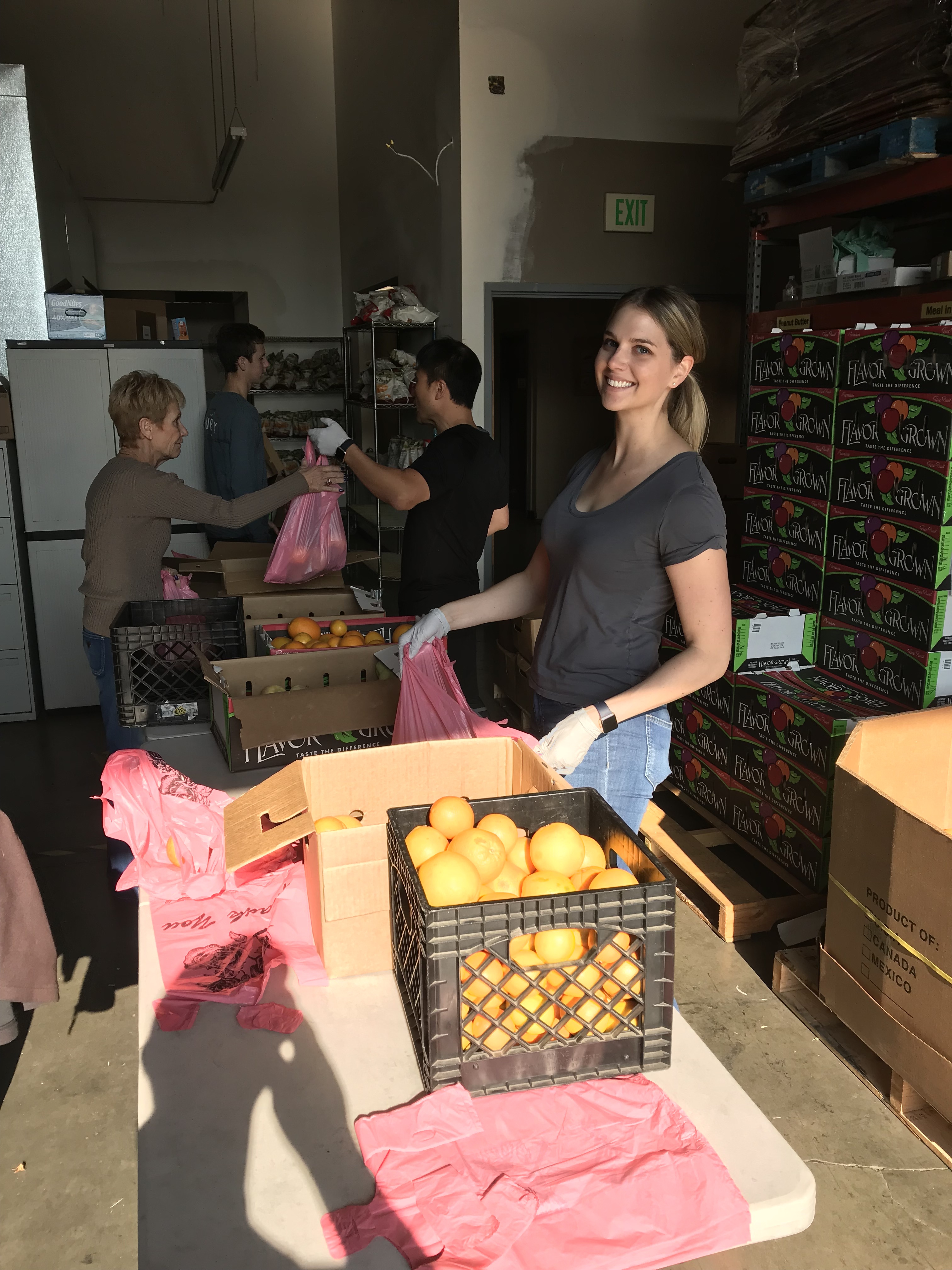 Kaitlyn preparing food packages on Thanksgiving