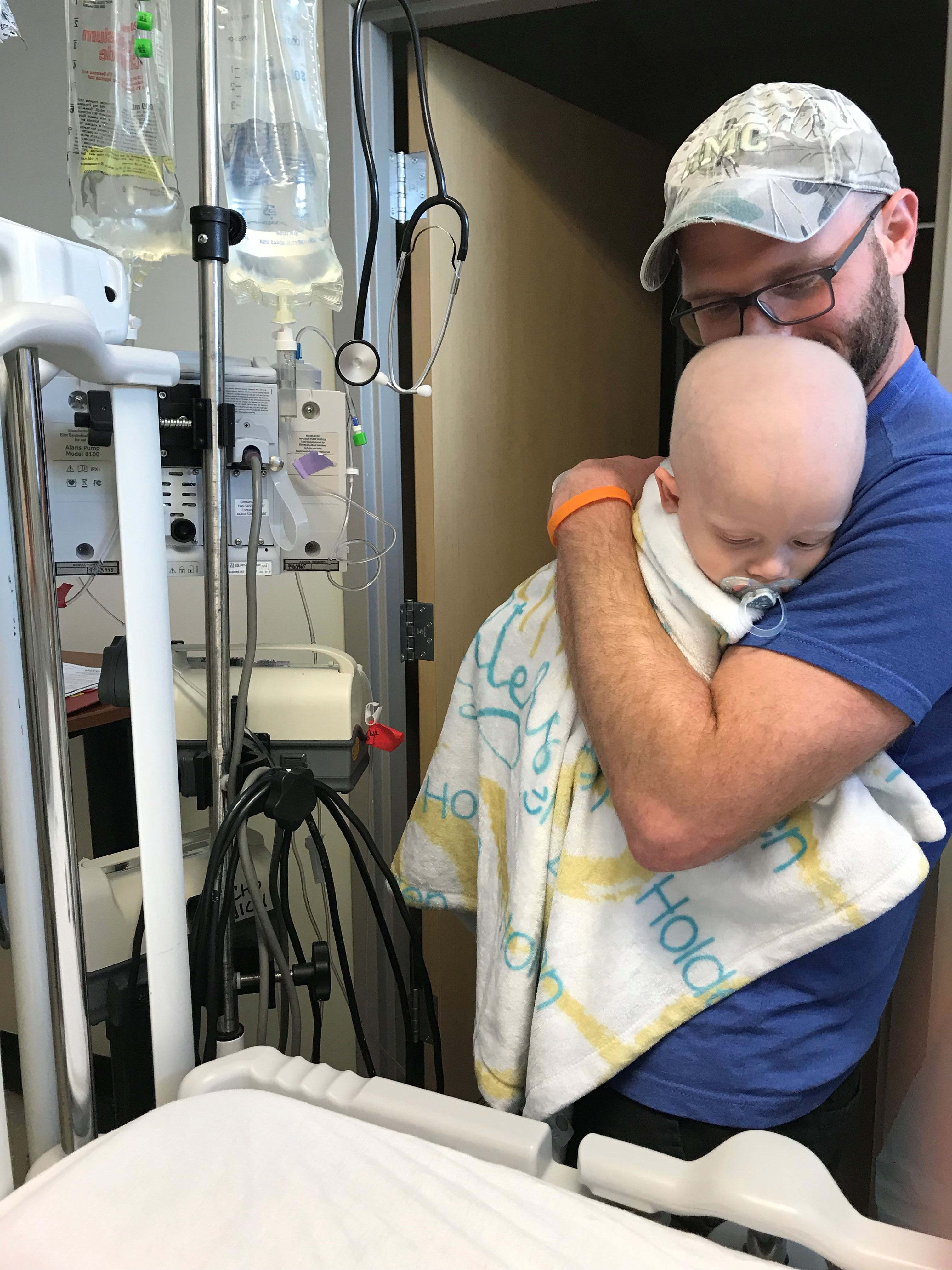 Preparing for surgery to remove his central line and place his port after an infection and fever.