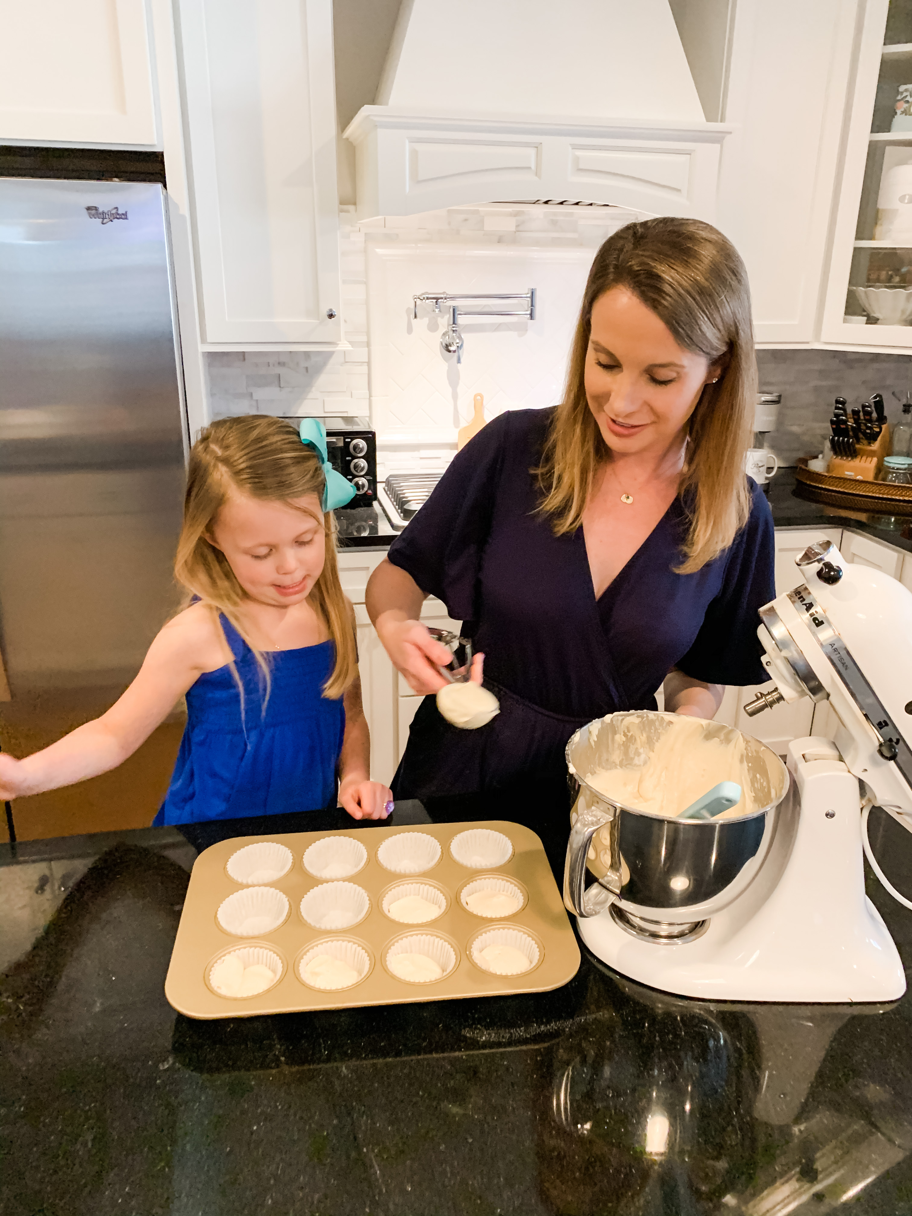 STEP 11 : Spoon your mixture into the cupcake liners about 2/3 of the way up. A large cookie scoop is a great tool to use for this!