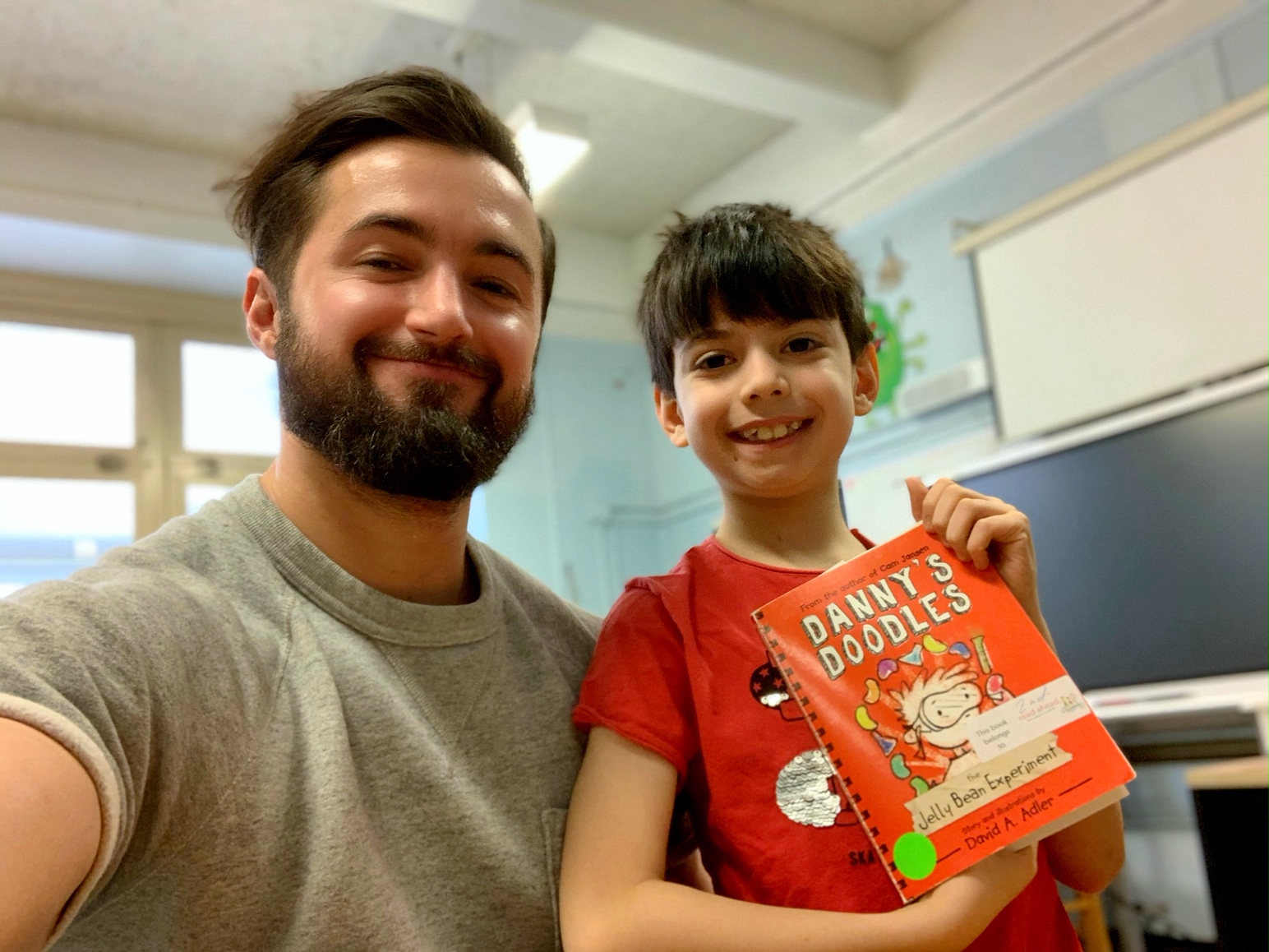 My friend Andrew and his reading buddy, Kayvan