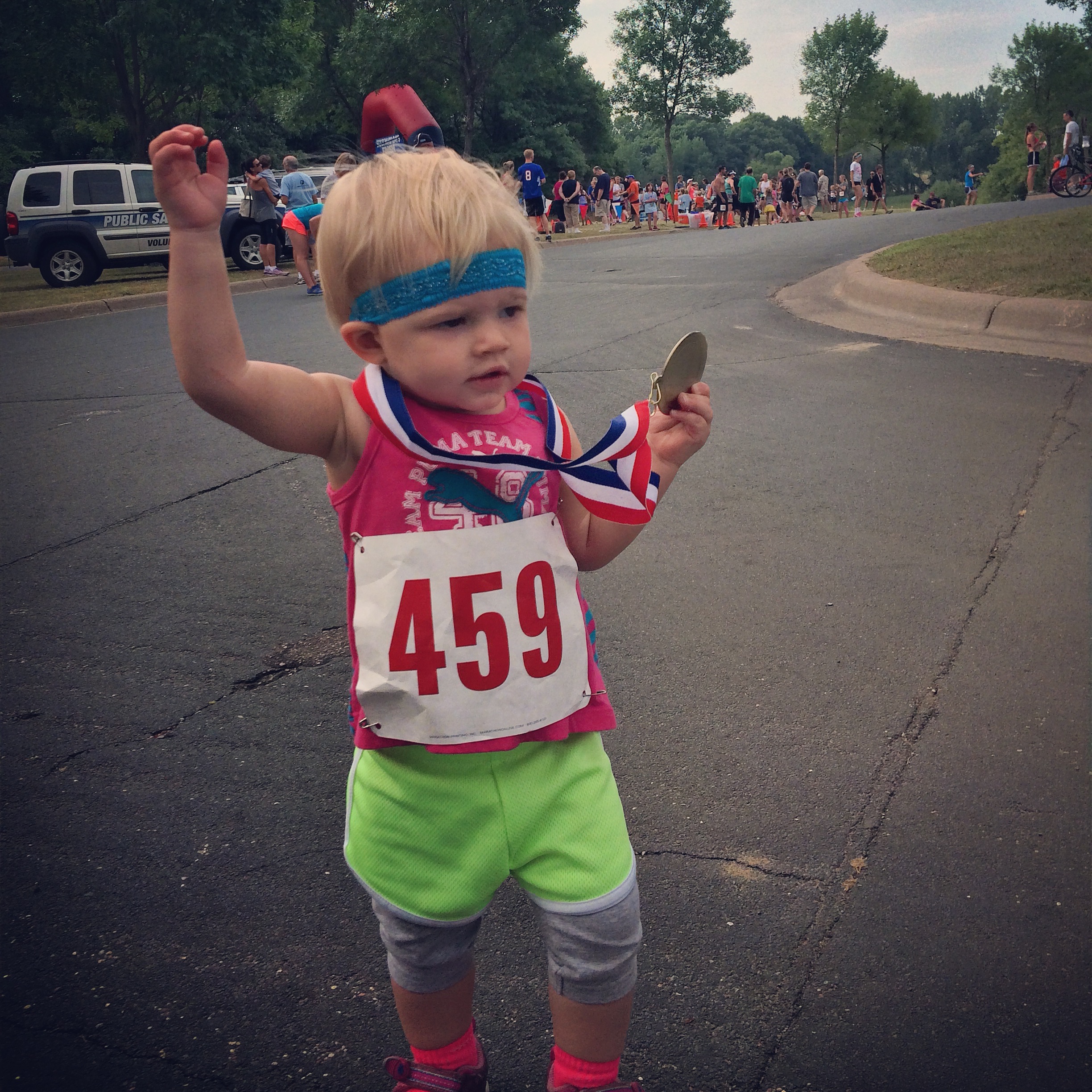 Kenley celebrating her first big race finish (age 1)