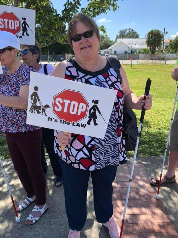 Lynn, a Lighthouse of the Blind and Low Vision client, enjoys the White Cane Walk.