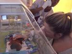 Mommy sees Micah for the first time the next day...  not at all how we planned our start, but we are thankful for the incredible outcome!