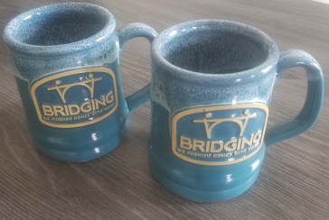 Fundraise at least $250 and get two Deneen pottery Bridging mugs!
