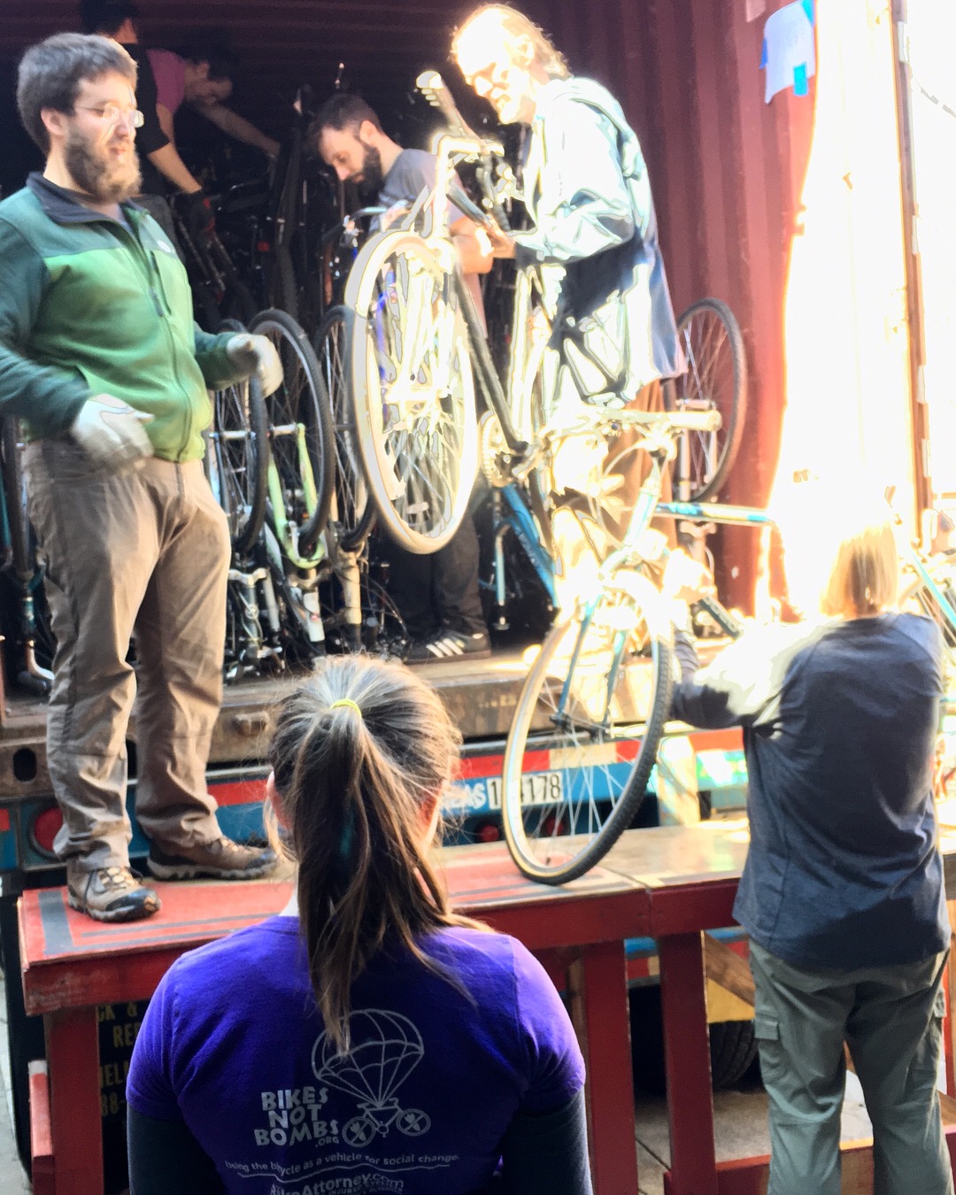 Maddy helping load a container of nearly 500 recycled bikes to Ghana on Earth Day 2018!