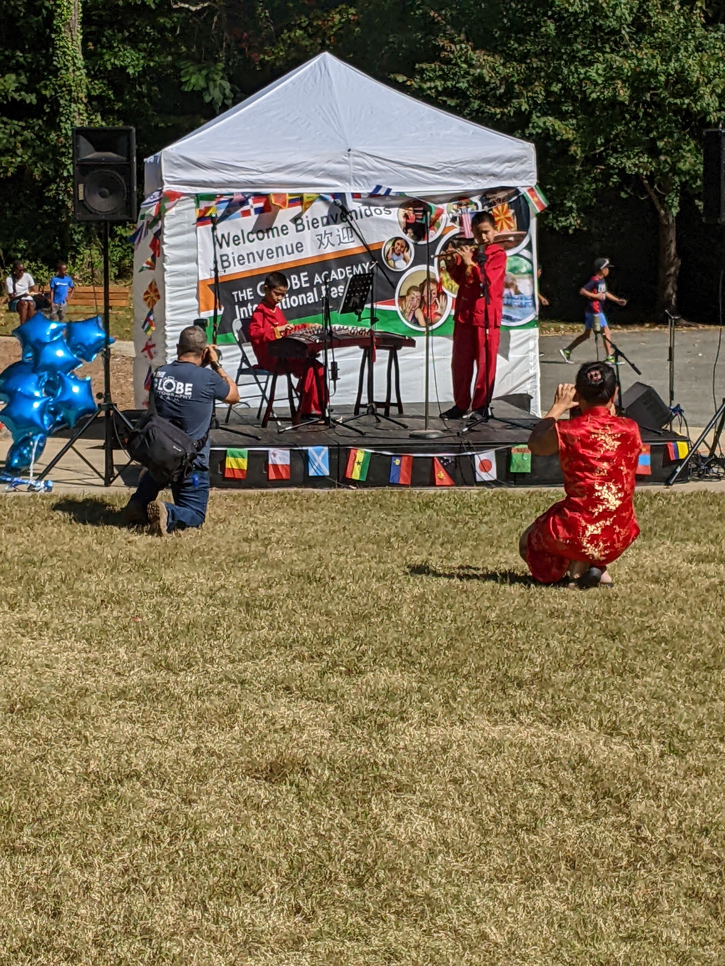 Asian Globe students playing traditional instruments