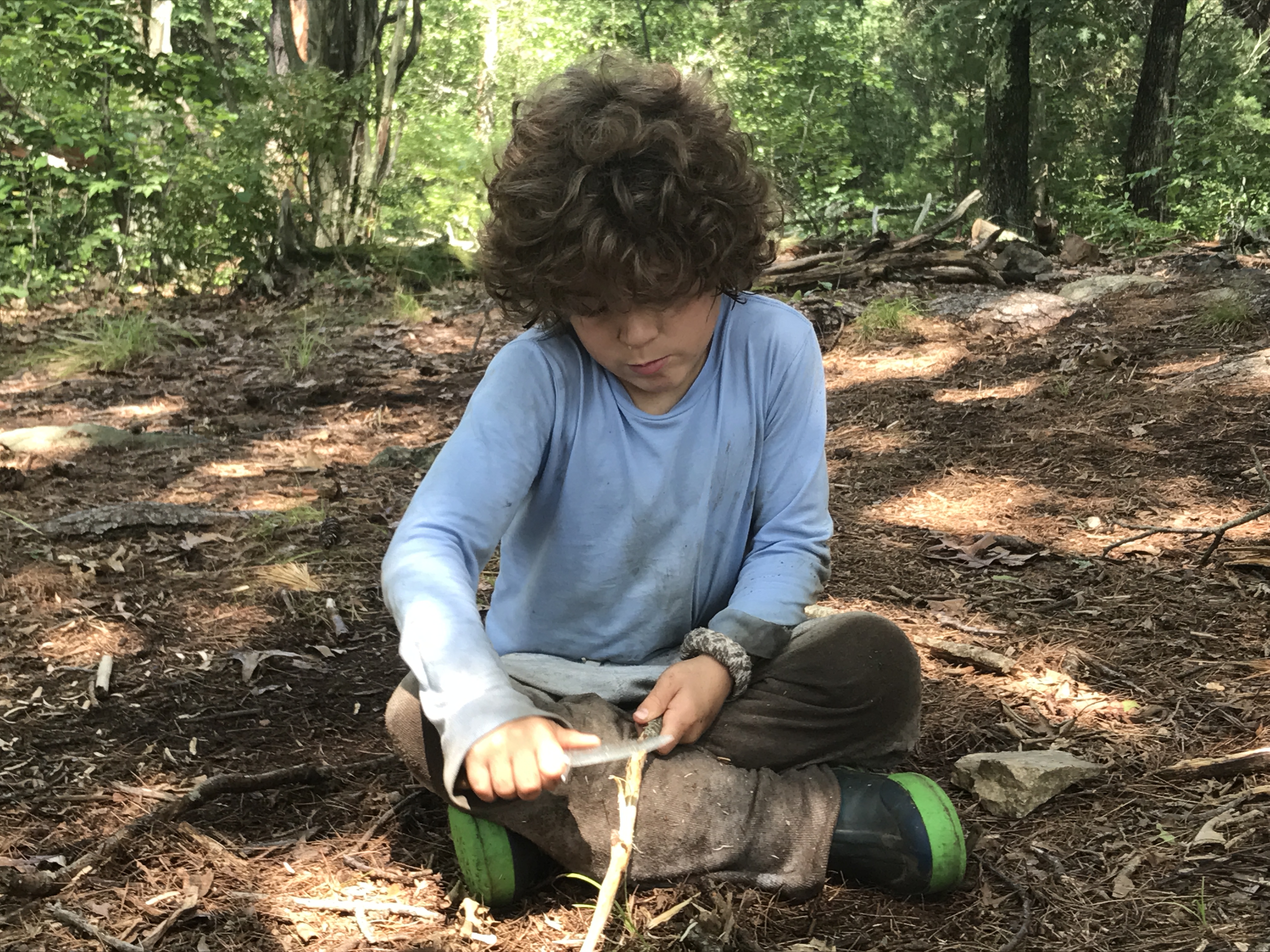 Whittling with knives to learn persistence and patience