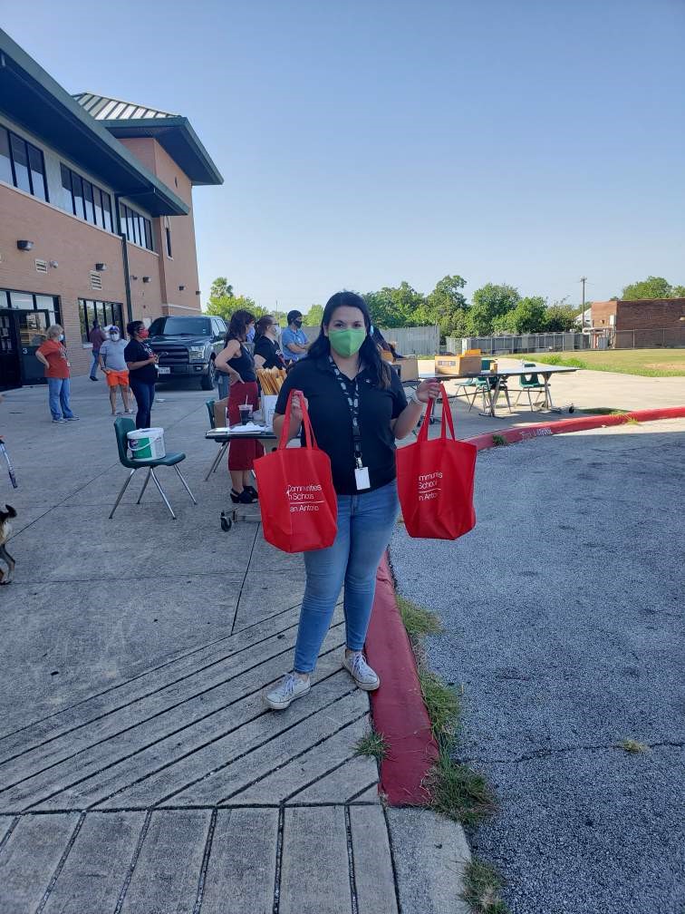 Handing out school supplies