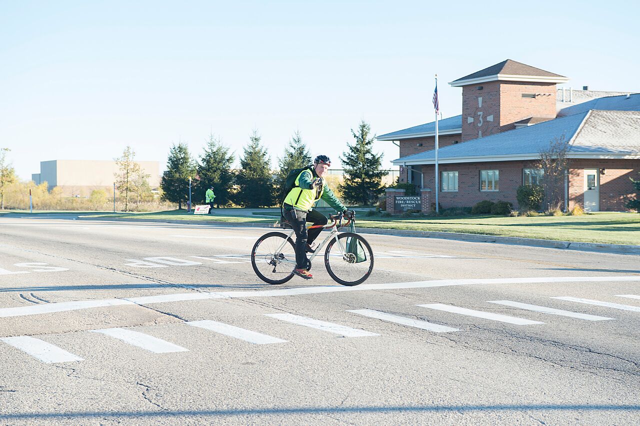 A volunteer biker helping direct traffic.